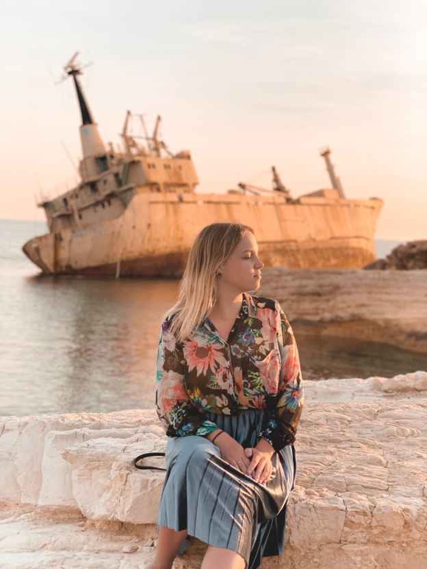 woman sitting on concrete dock